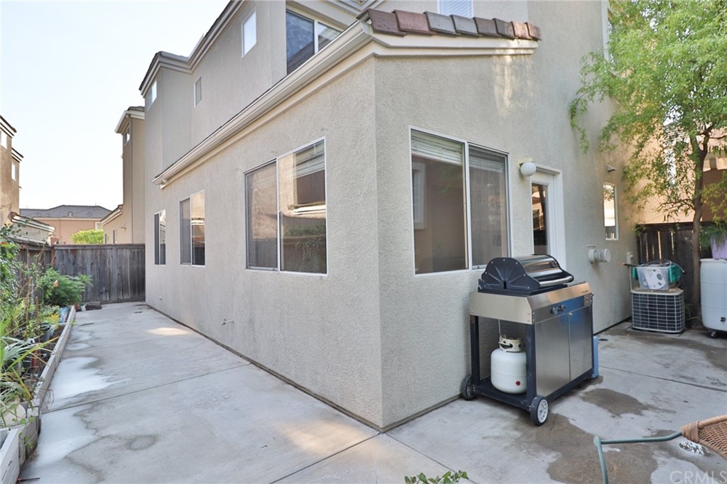 6 Rue Monet Lake Forest, CA 92610 - Photo 24 of 24 The patio as it wraps around the home. At the end, it continues out to the driveway.