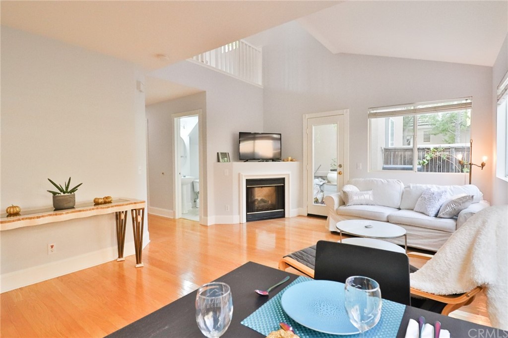 6 Rue Monet Lake Forest, CA 92610 - Photo 10 of 24 Another view of the dining room/living room showing the entry hall and downstairs half bath.
