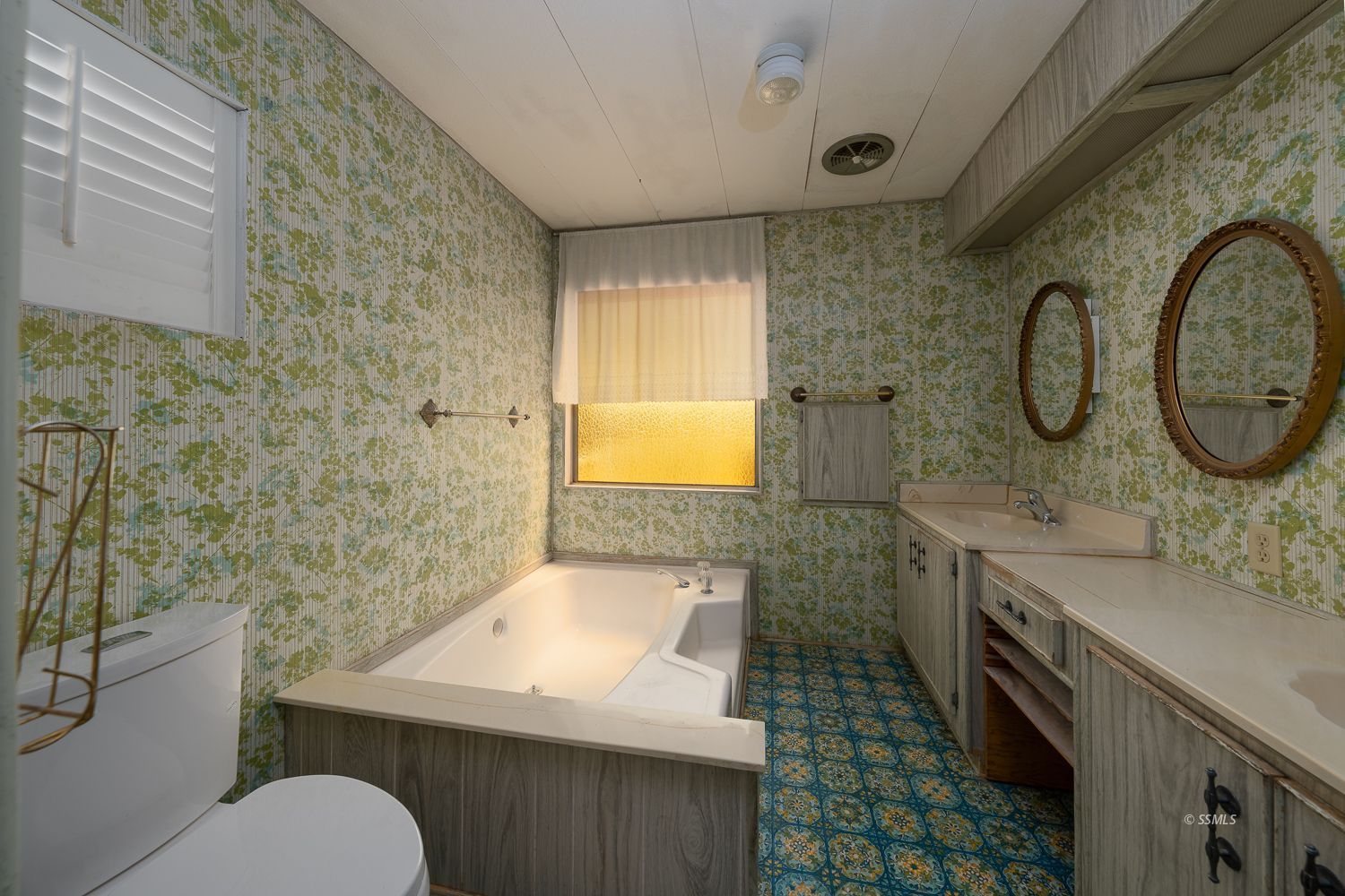 2003 Sydnor Avenue Ridgecrest, CA 93555 - Photo 16 of 35 a bathroom with a sink a toilet and mirror