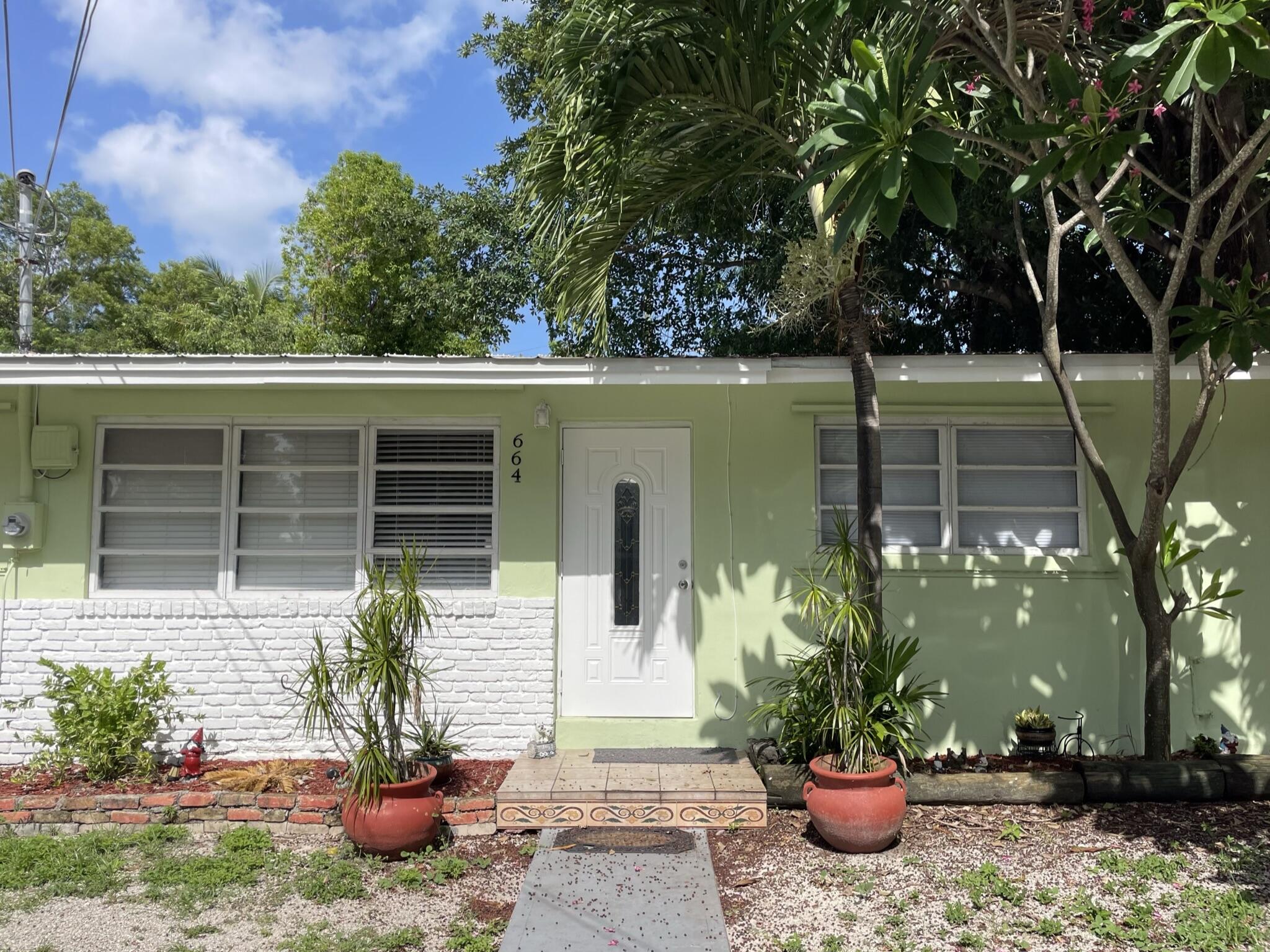 a house view with a garden space