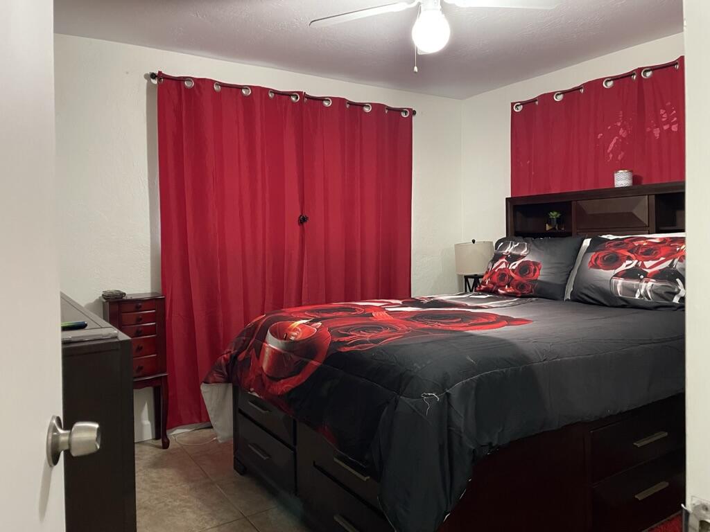 664 Colson Drive Key Largo, FL 33037 - Photo 13 of 36 a bedroom with a bed and a lamp on dresser