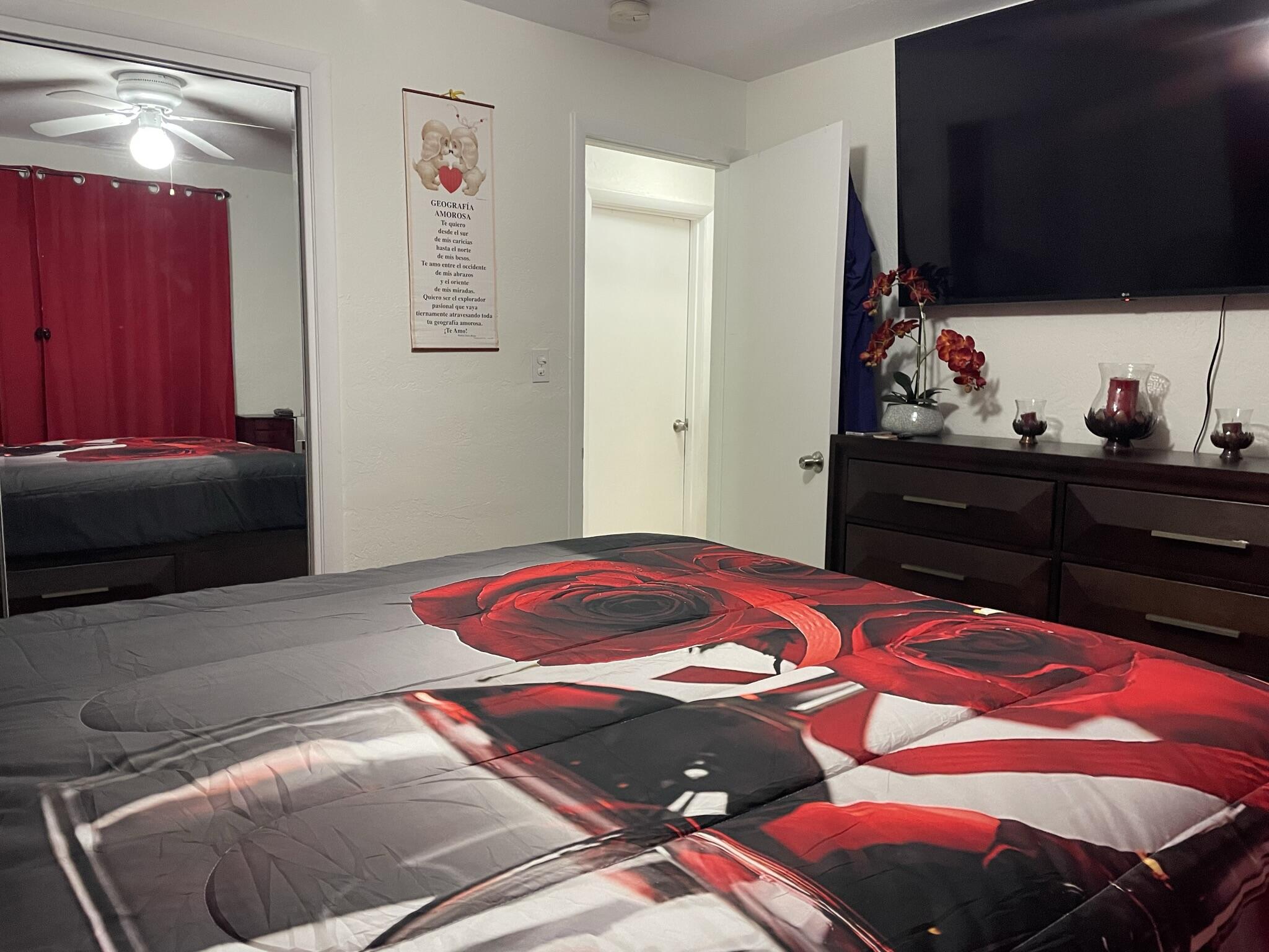 664 Colson Drive Key Largo, FL 33037 - Photo 14 of 36 a bedroom with a bed and a flat tv screen