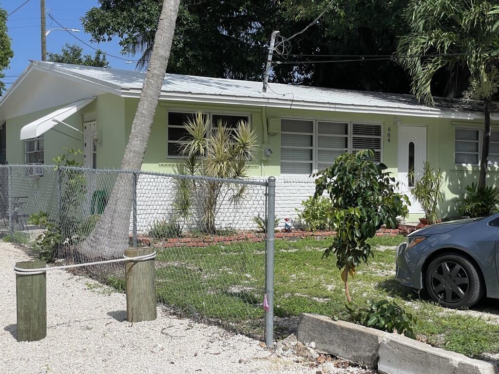 664 Colson Drive Key Largo, FL 33037 - Photo 22 of 36 a front view of a house with garden