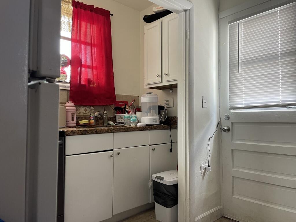 664 Colson Drive Key Largo, FL 33037 - Photo 24 of 36 a bathroom with a toilet a sink and a window