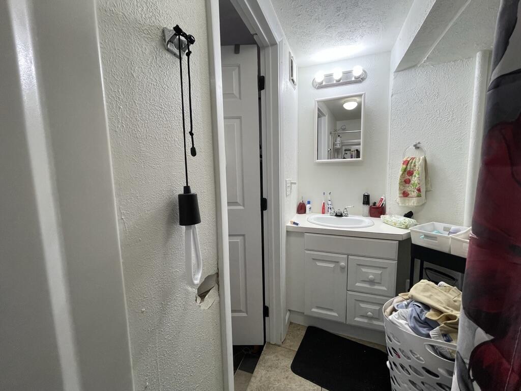 664 Colson Drive Key Largo, FL 33037 - Photo 26 of 36 a bathroom with a sink vanity and tub