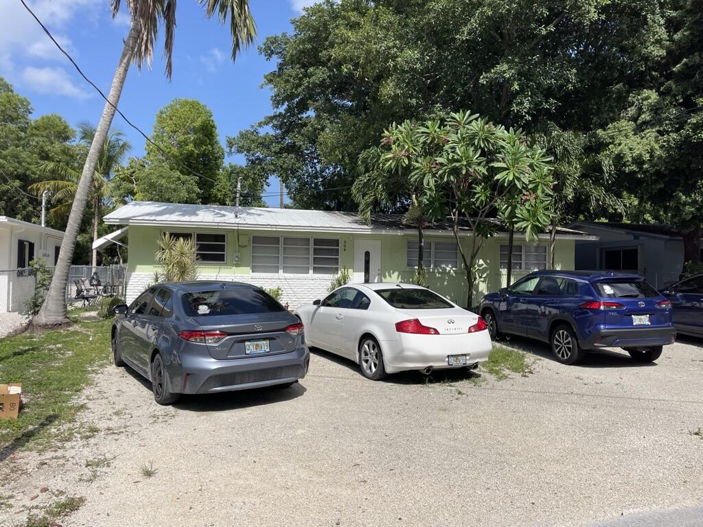 664 Colson Drive Key Largo, FL 33037 - Photo 33 of 36 a car parked in front of a house