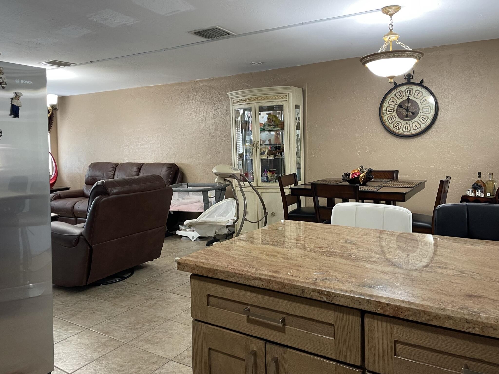 664 Colson Drive Key Largo, FL 33037 - Photo 10 of 36 a living room with furniture chandelier and a window