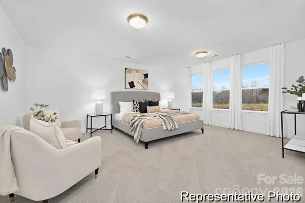 a bedroom with a bed and a couch