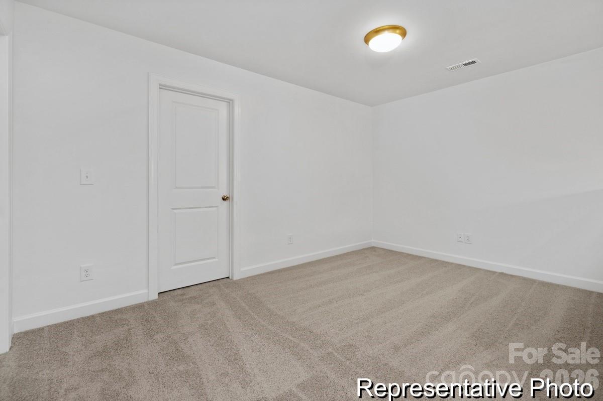 155 Soft Breeze Bend, Unit 286B Locust, NC 28097 - Photo 21 of 28 an empty room with an entrance