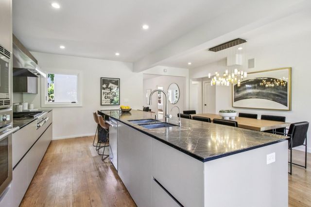 a bathroom with a toilet a sink and a mirror