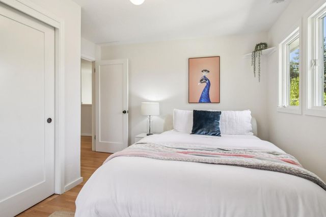 a front view of a house with a yard and a garage