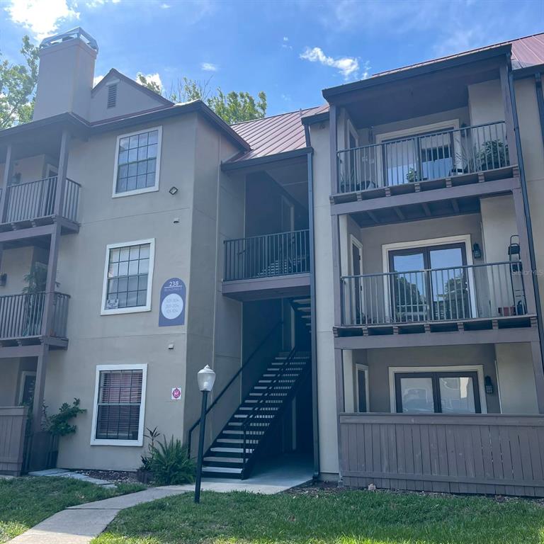 238 Afton Square, Unit 103 Altamonte Springs, FL 32714 - Photo 1 of 16 a view of a house with a yard