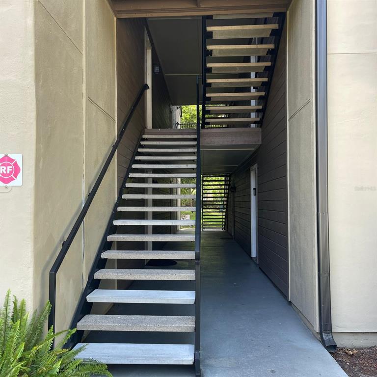 238 Afton Square, Unit 103 Altamonte Springs, FL 32714 - Photo 3 of 16 a view of entryway and hall with wooden floor