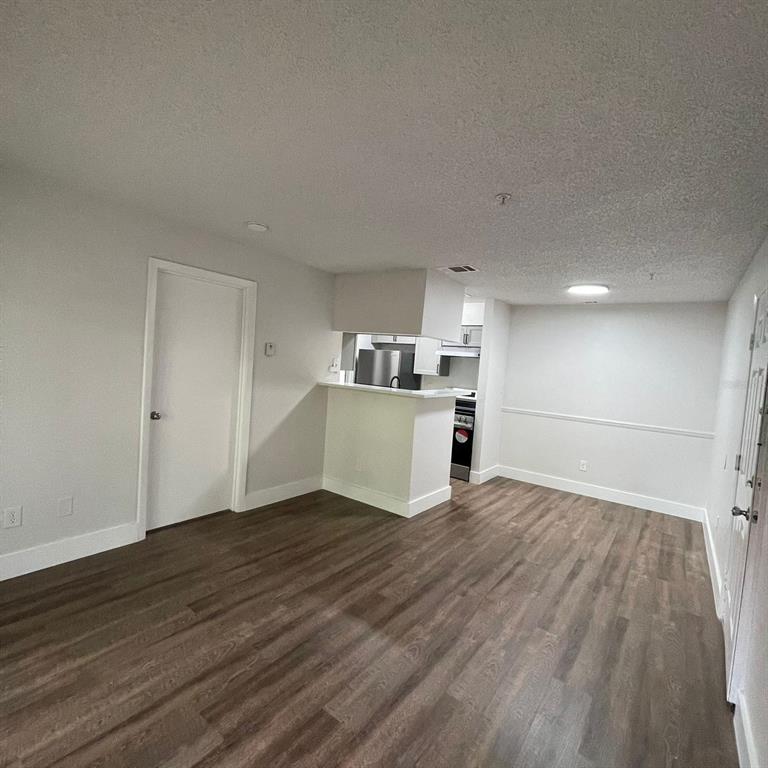 238 Afton Square, Unit 103 Altamonte Springs, FL 32714 - Photo 7 of 16 a view of a kitchen with wooden floor and a sink
