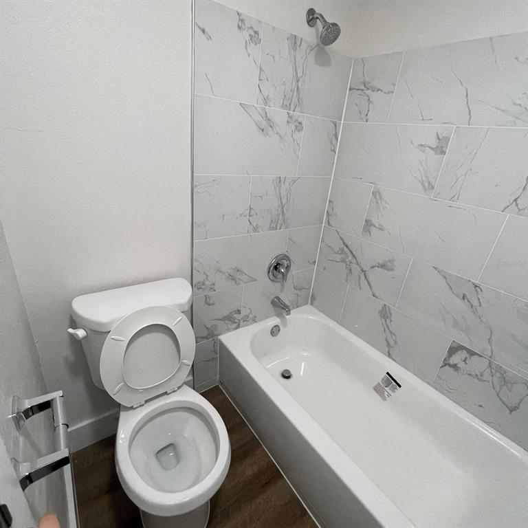 238 Afton Square, Unit 103 Altamonte Springs, FL 32714 - Photo 10 of 16 a bathroom with a sink a toilet and bathtub
