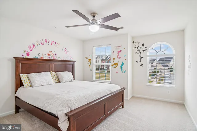 a car parked in front of a white building