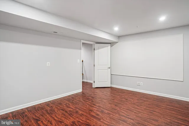 a view of a big room with table and chairs