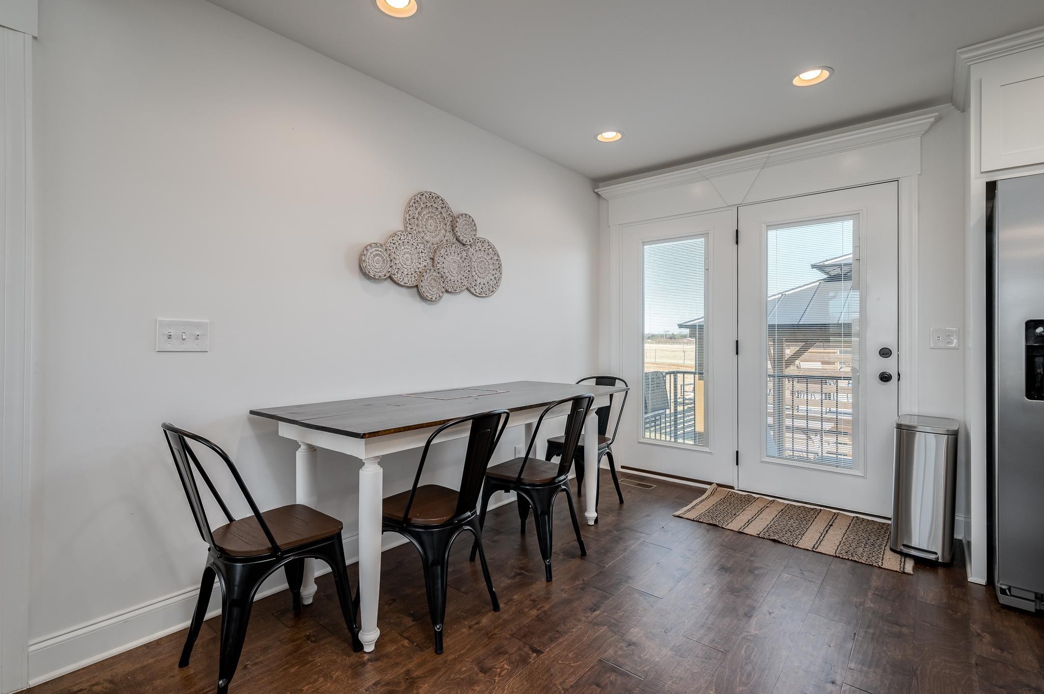 105 Autumn Cove Road Bell Buckle, TN 37020 - Photo 12 of 32 a view of a dining room with furniture and wooden floor