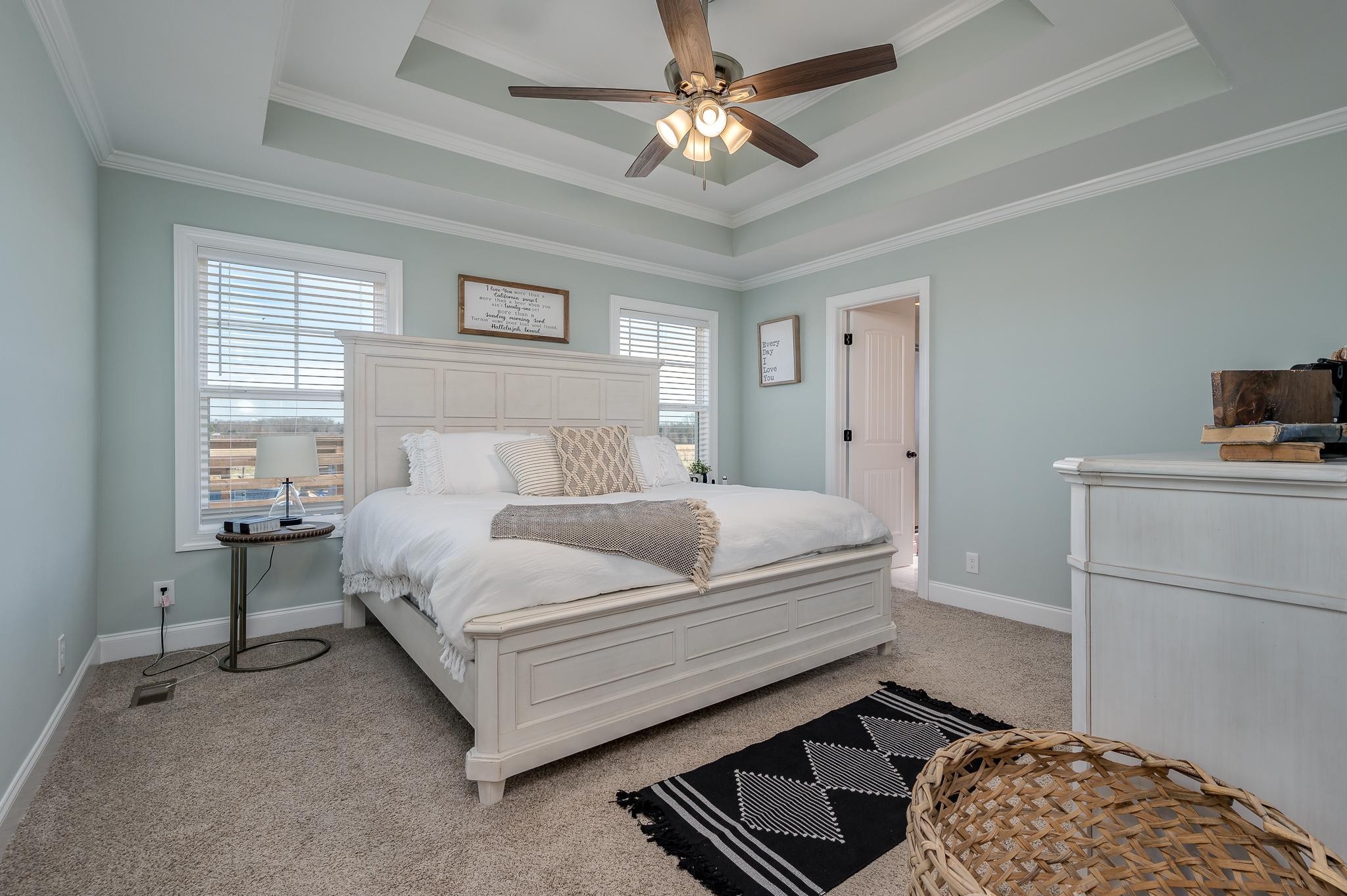 105 Autumn Cove Road Bell Buckle, TN 37020 - Photo 13 of 32 a bedroom with a bed and a chandelier