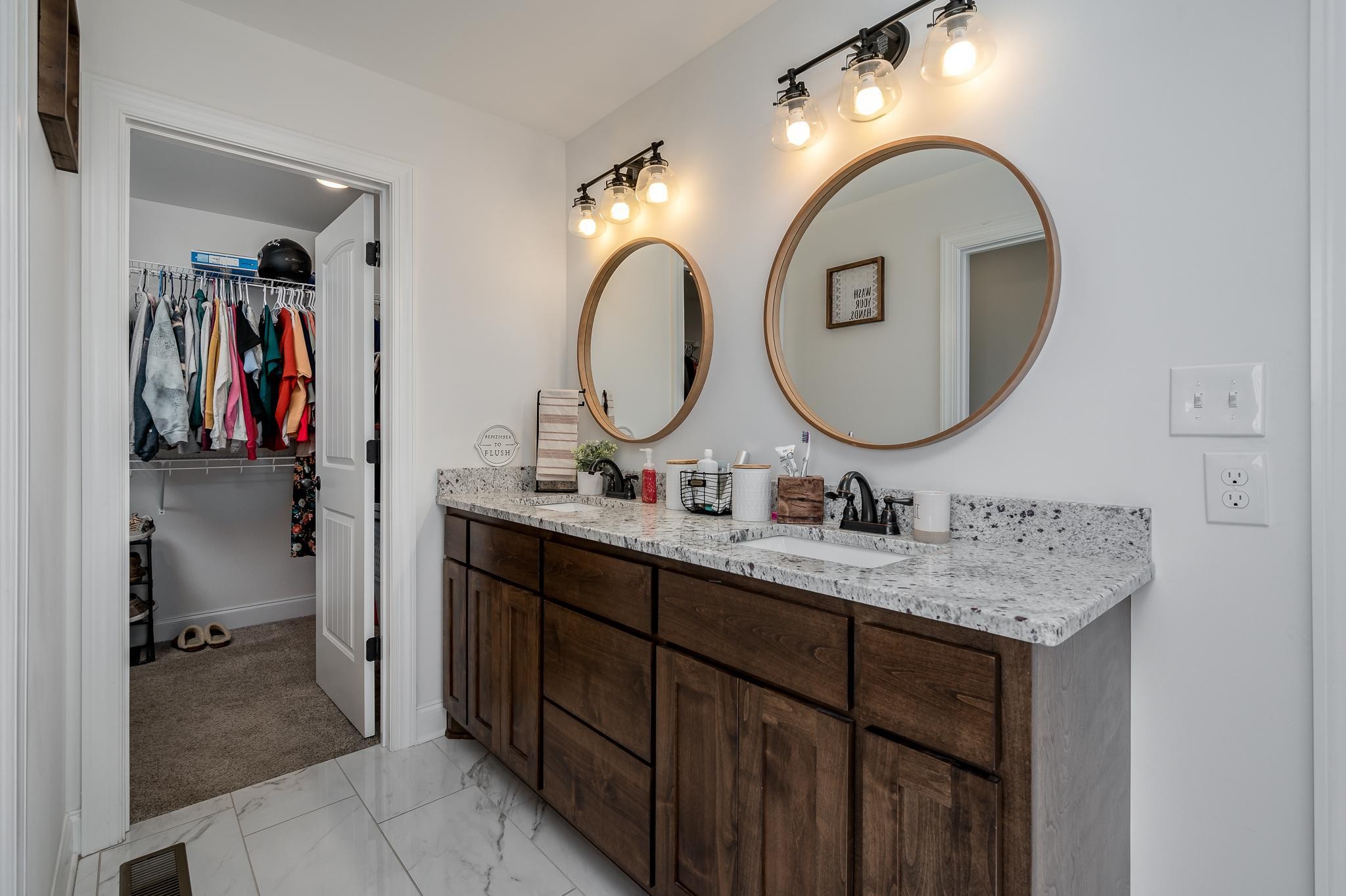 105 Autumn Cove Road Bell Buckle, TN 37020 - Photo 18 of 32 a bathroom with a double vanity sink and a mirror