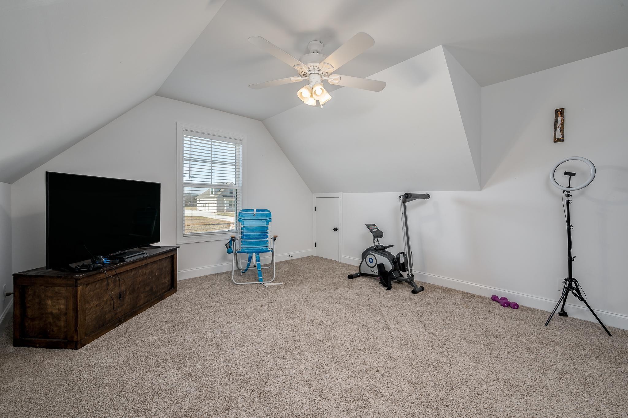 105 Autumn Cove Road Bell Buckle, TN 37020 - Photo 22 of 32 a living room with furniture and a flat screen tv