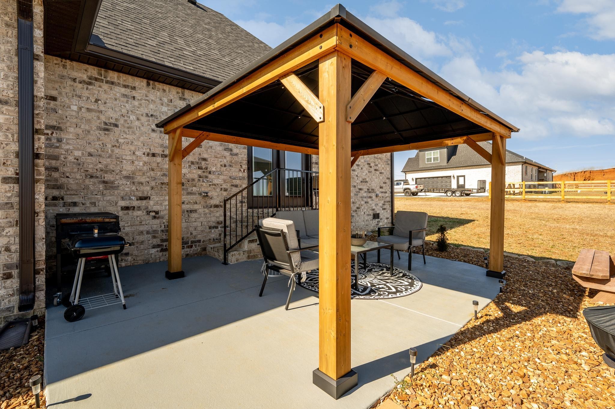 105 Autumn Cove Road Bell Buckle, TN 37020 - Photo 24 of 32 a patio with table and chairs