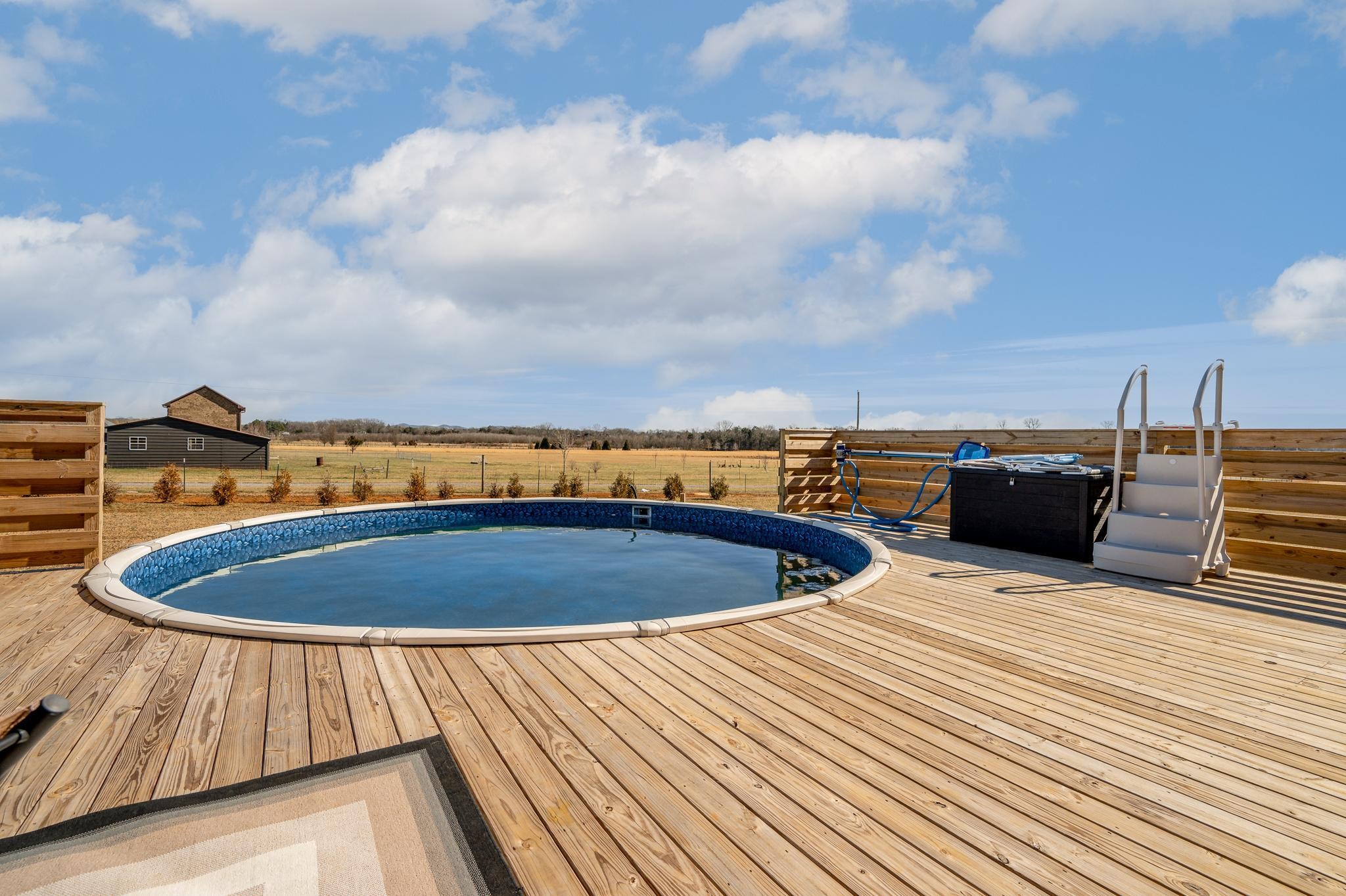 105 Autumn Cove Road Bell Buckle, TN 37020 - Photo 26 of 32 a view of roof deck with a barbeque and wooden floor