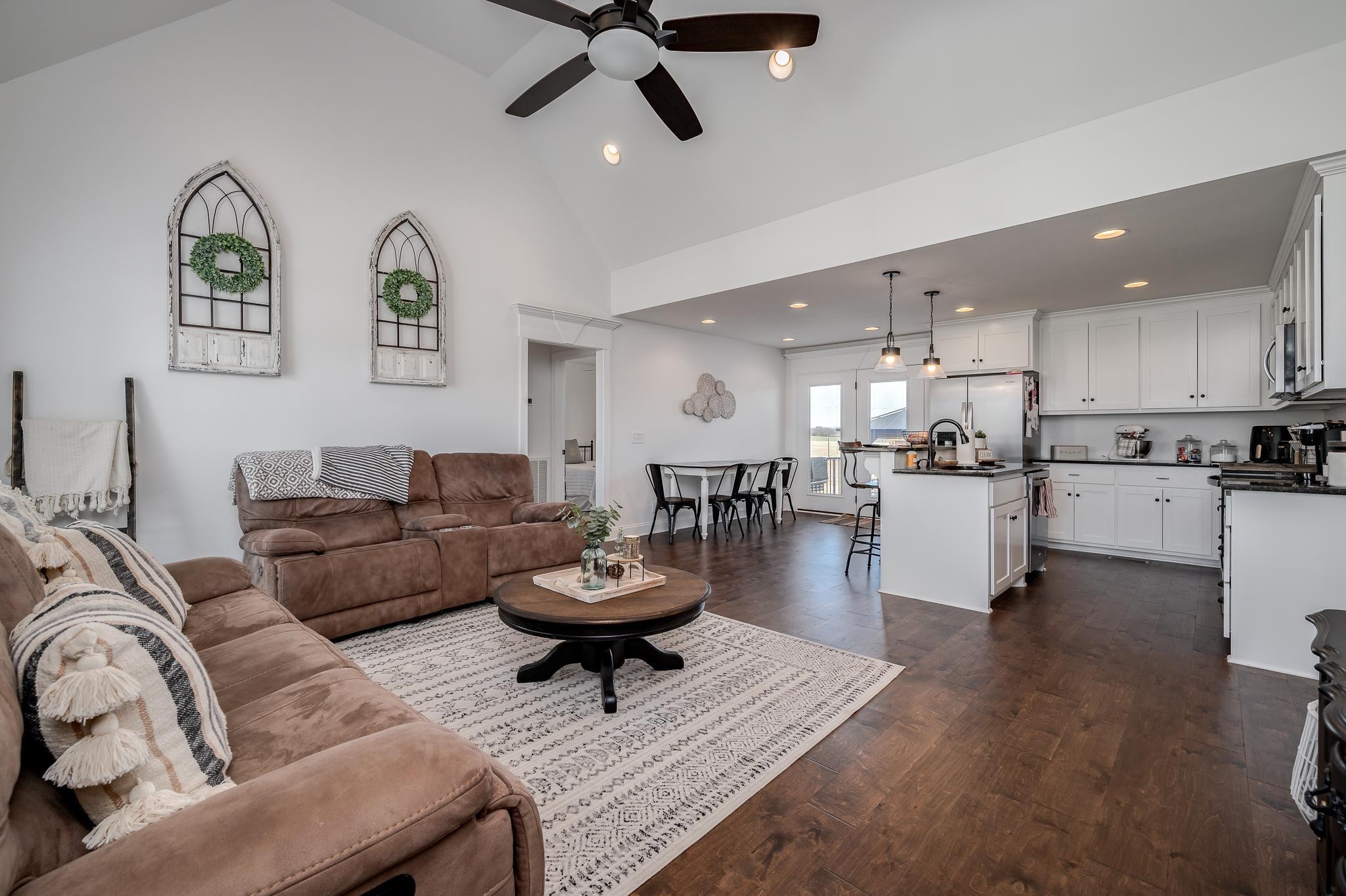 105 Autumn Cove Road Bell Buckle, TN 37020 - Photo 7 of 32 a living room with fireplace furniture and a view of kitchen