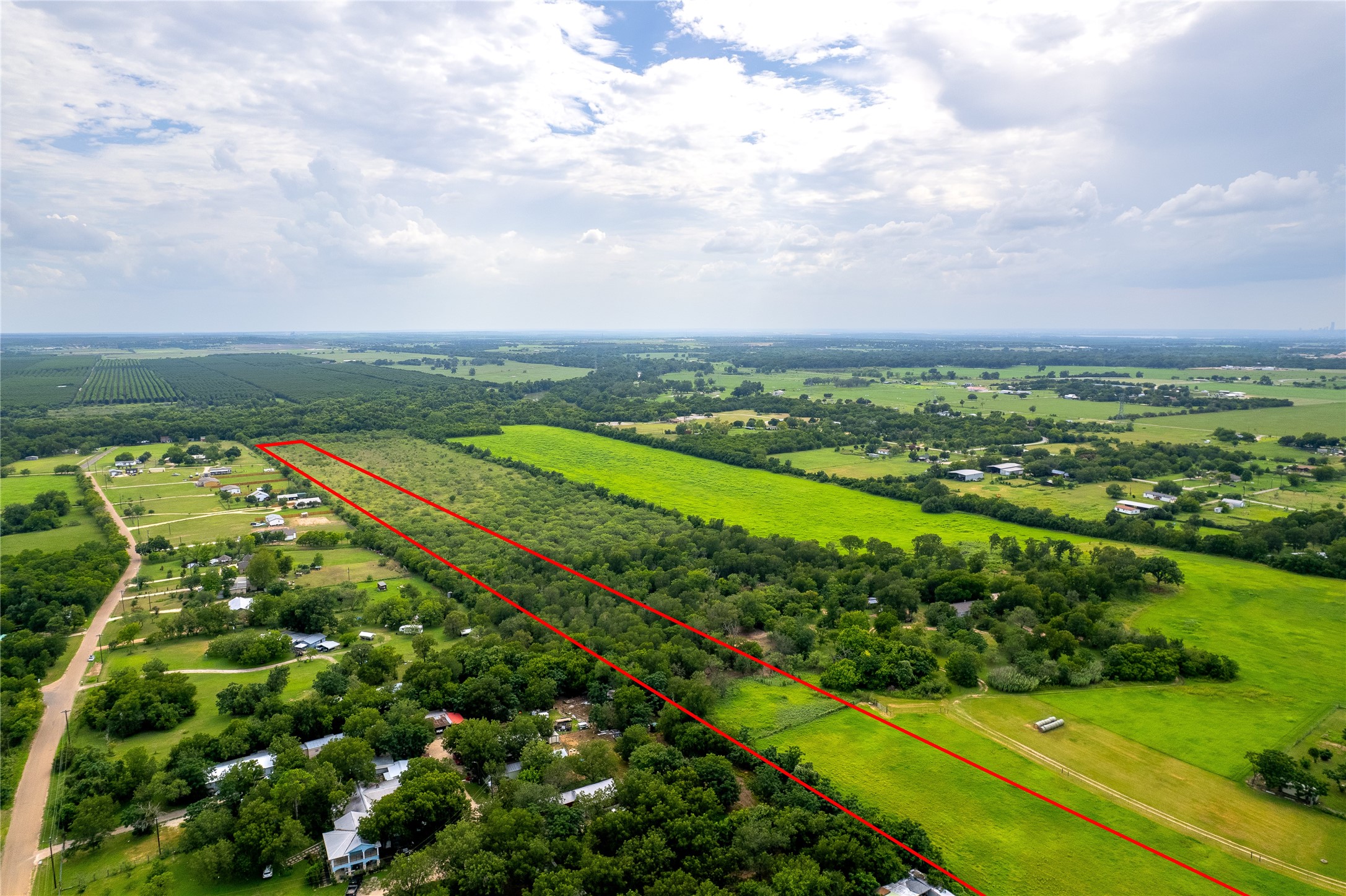 969 Rd Elgin Tx 78602 Road Elgin, TX 78621 - Photo 7 of 17 Aerial view of sparsely populated area featuring rows of crops