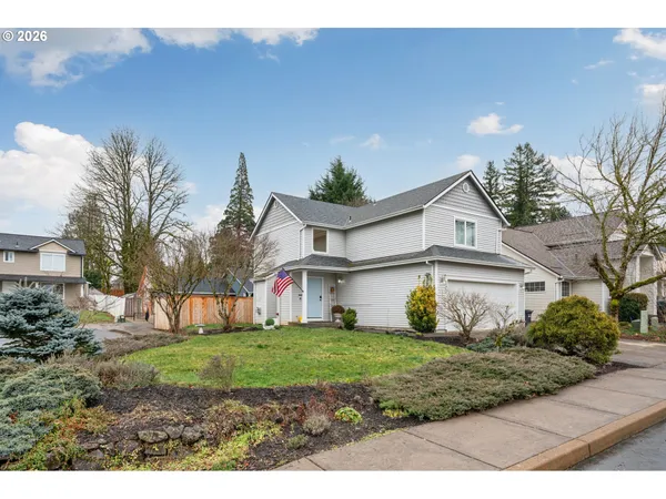 a view of front of house with a yard