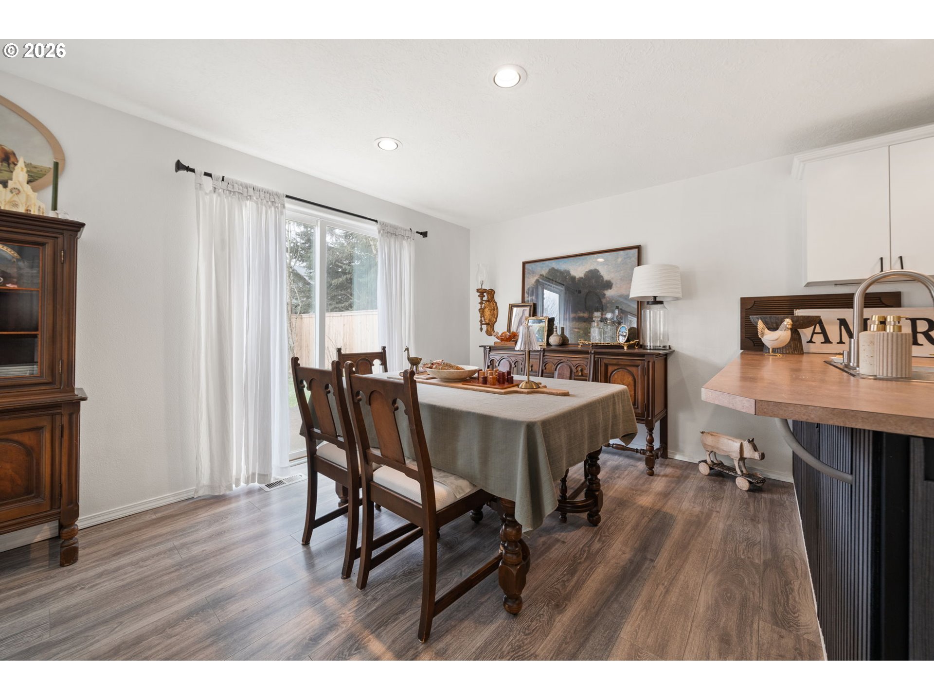 15902 Dreamcatcher Avenue Sandy, OR 97055 - Photo 11 of 32 a view of a dining room with furniture and wooden floor