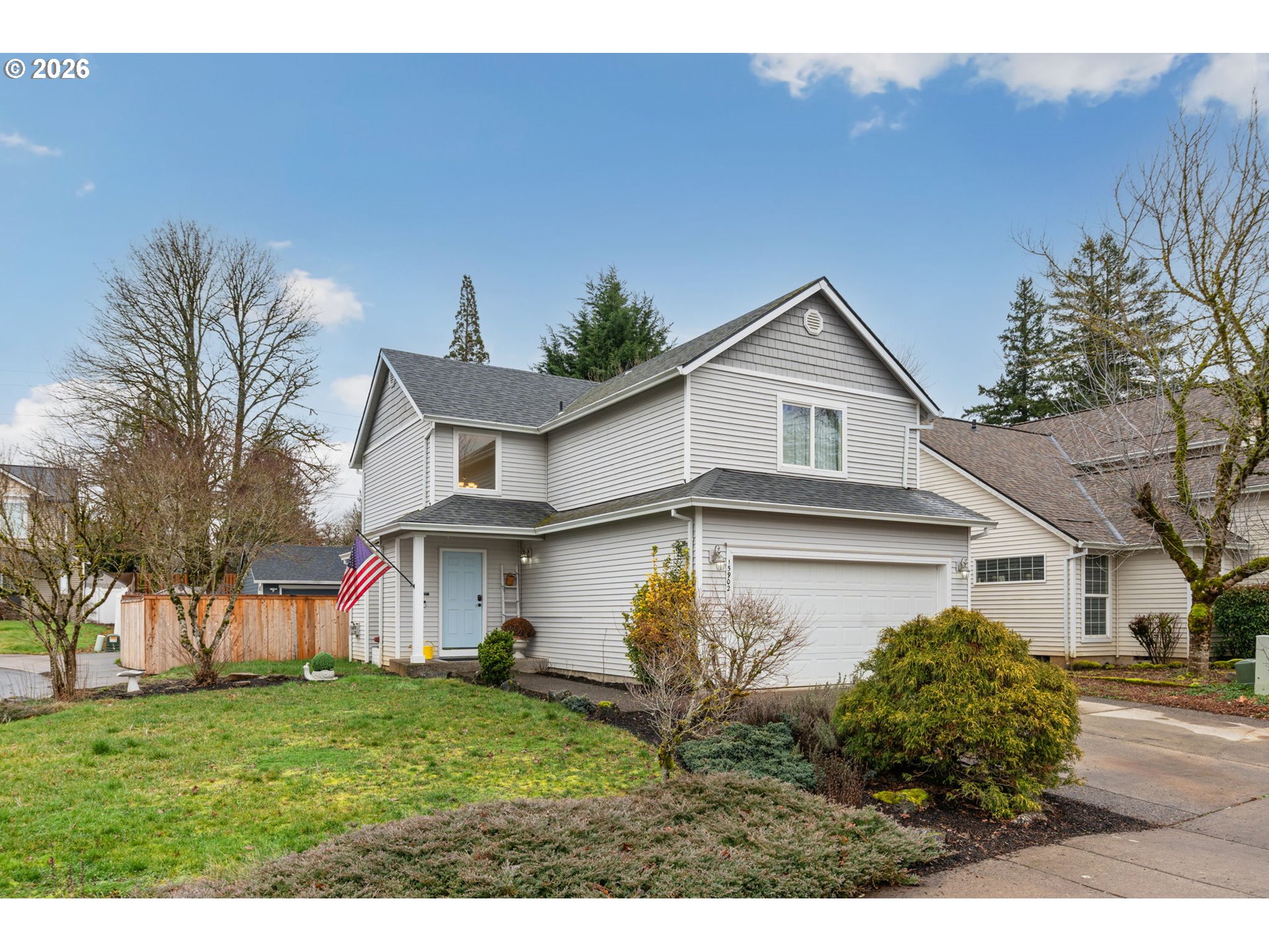 15902 Dreamcatcher Avenue Sandy, OR 97055 - Photo 2 of 32 a front view of a house with a yard and garage