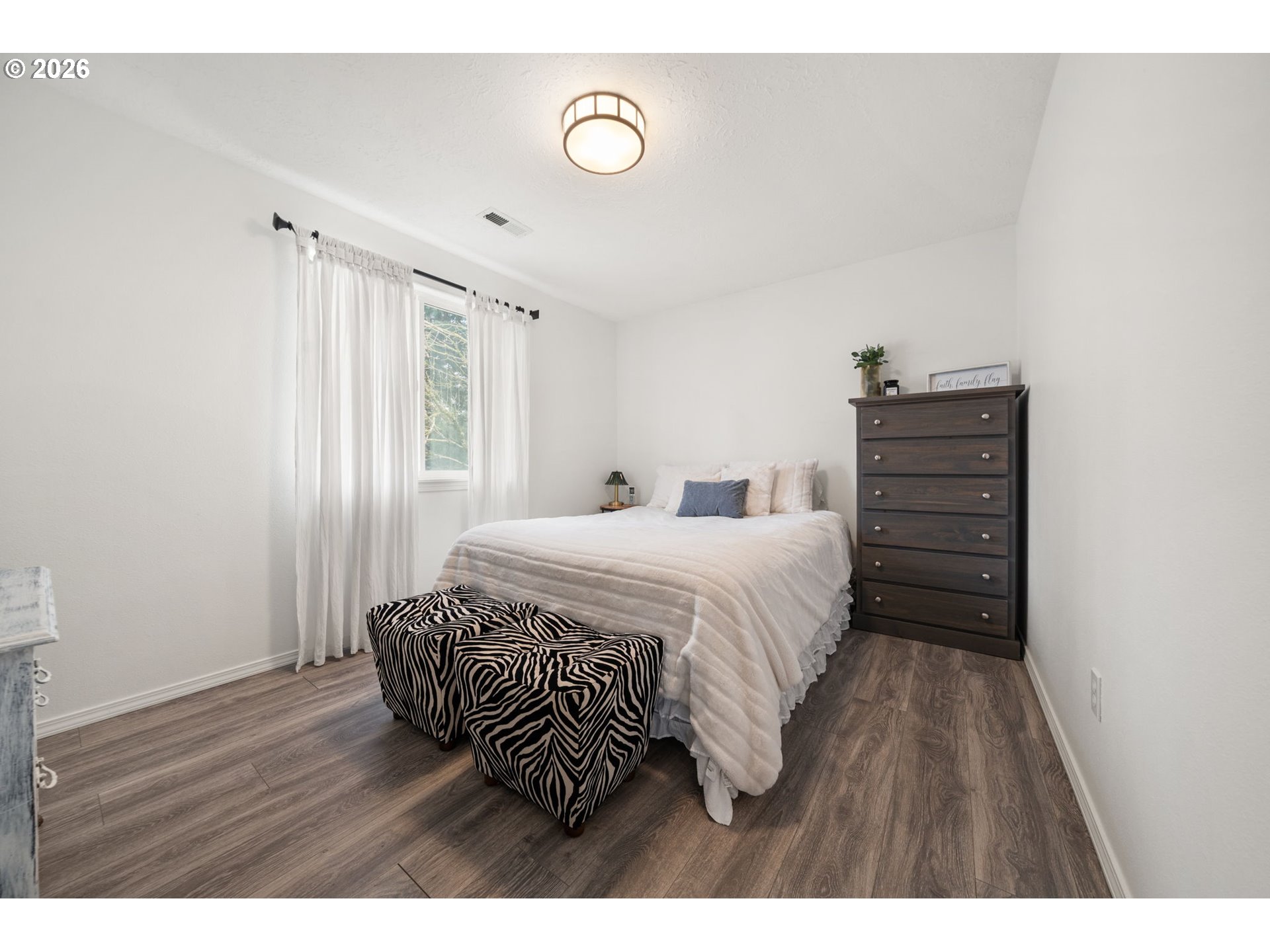 15902 Dreamcatcher Avenue Sandy, OR 97055 - Photo 22 of 32 a bedroom with a bed and a dresser
