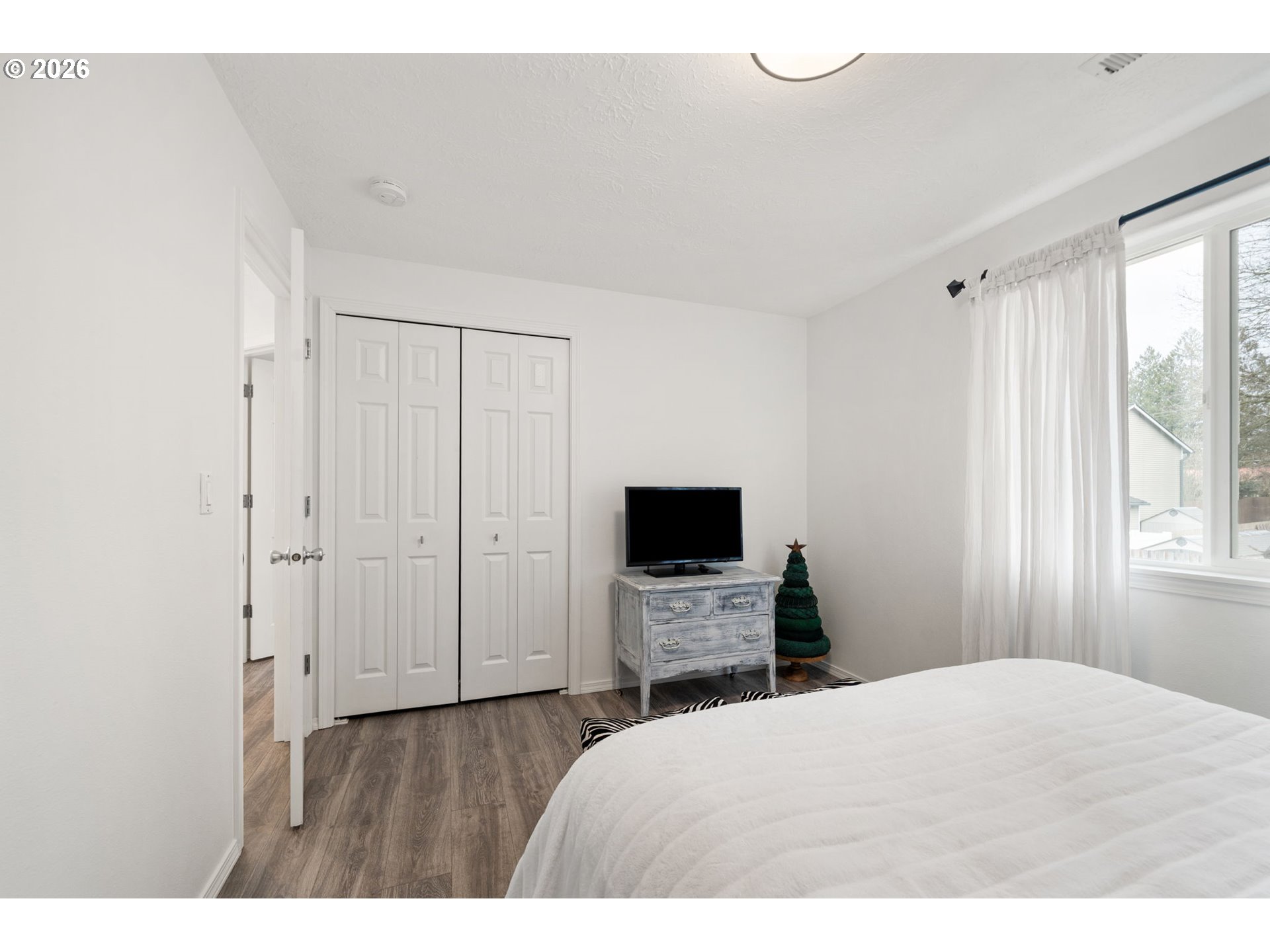 15902 Dreamcatcher Avenue Sandy, OR 97055 - Photo 23 of 32 a bedroom with a bed and a flat screen tv