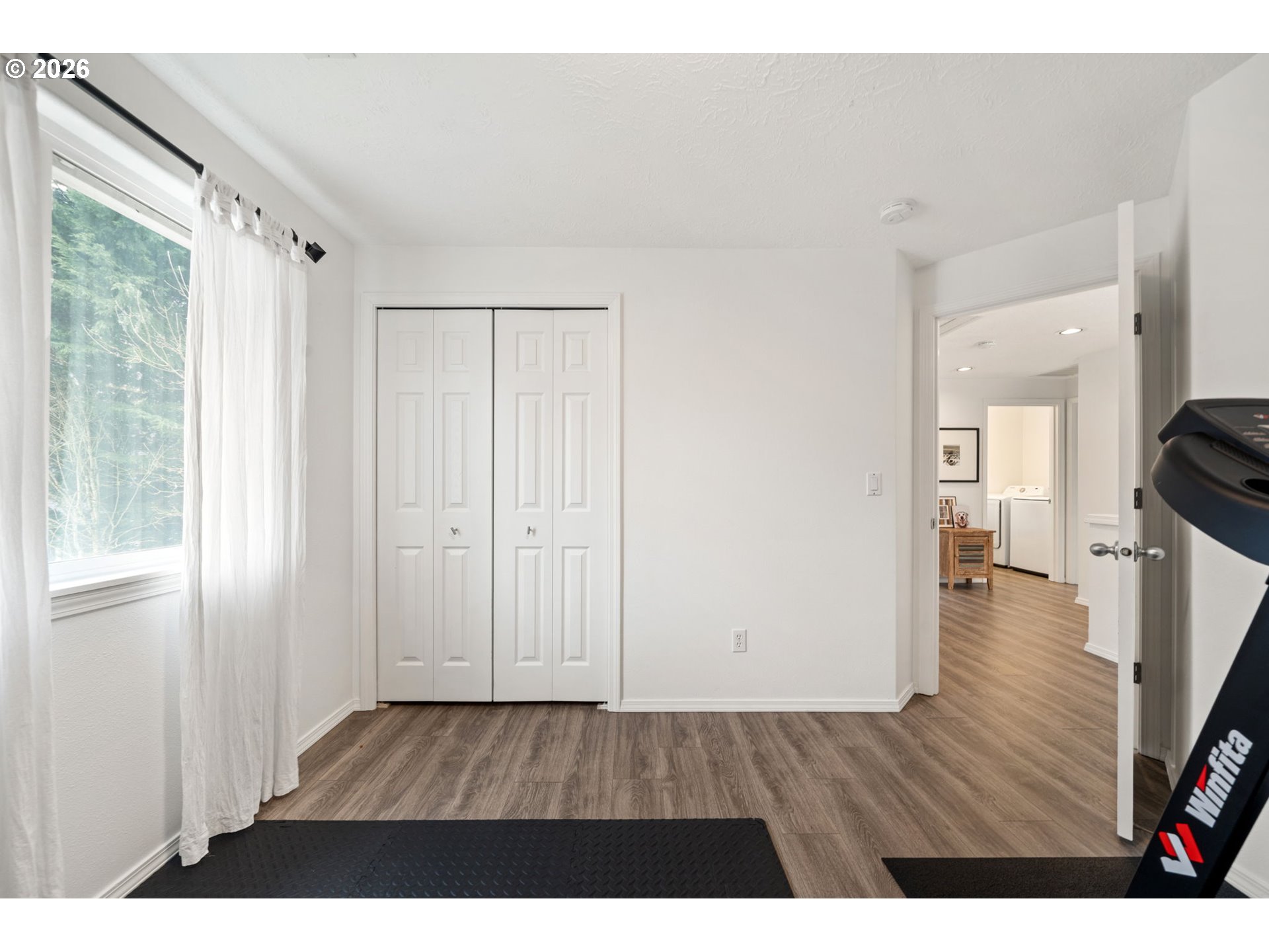 15902 Dreamcatcher Avenue Sandy, OR 97055 - Photo 26 of 32 a room with wooden floor and windows