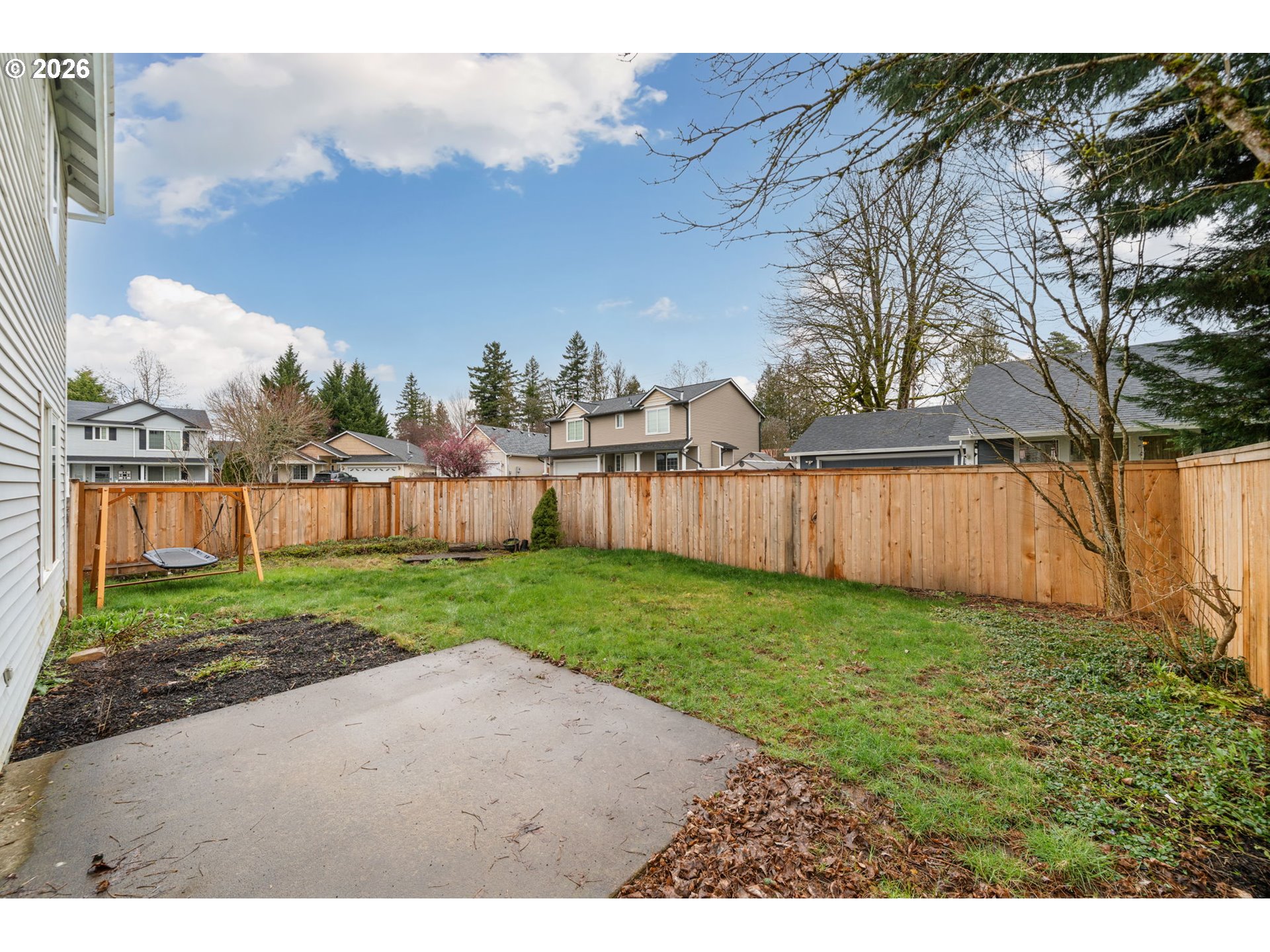 15902 Dreamcatcher Avenue Sandy, OR 97055 - Photo 30 of 32 a view of a backyard with wooden fence