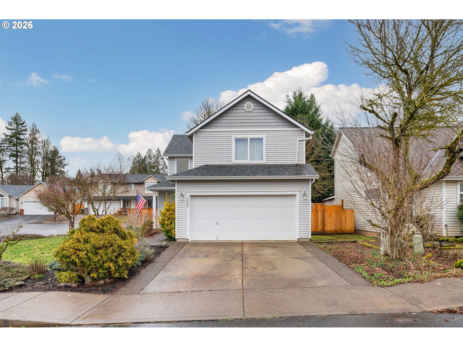 15902 Dreamcatcher Avenue Sandy, OR 97055 - Photo 3 of 32 a front view of a house with a yard and garage