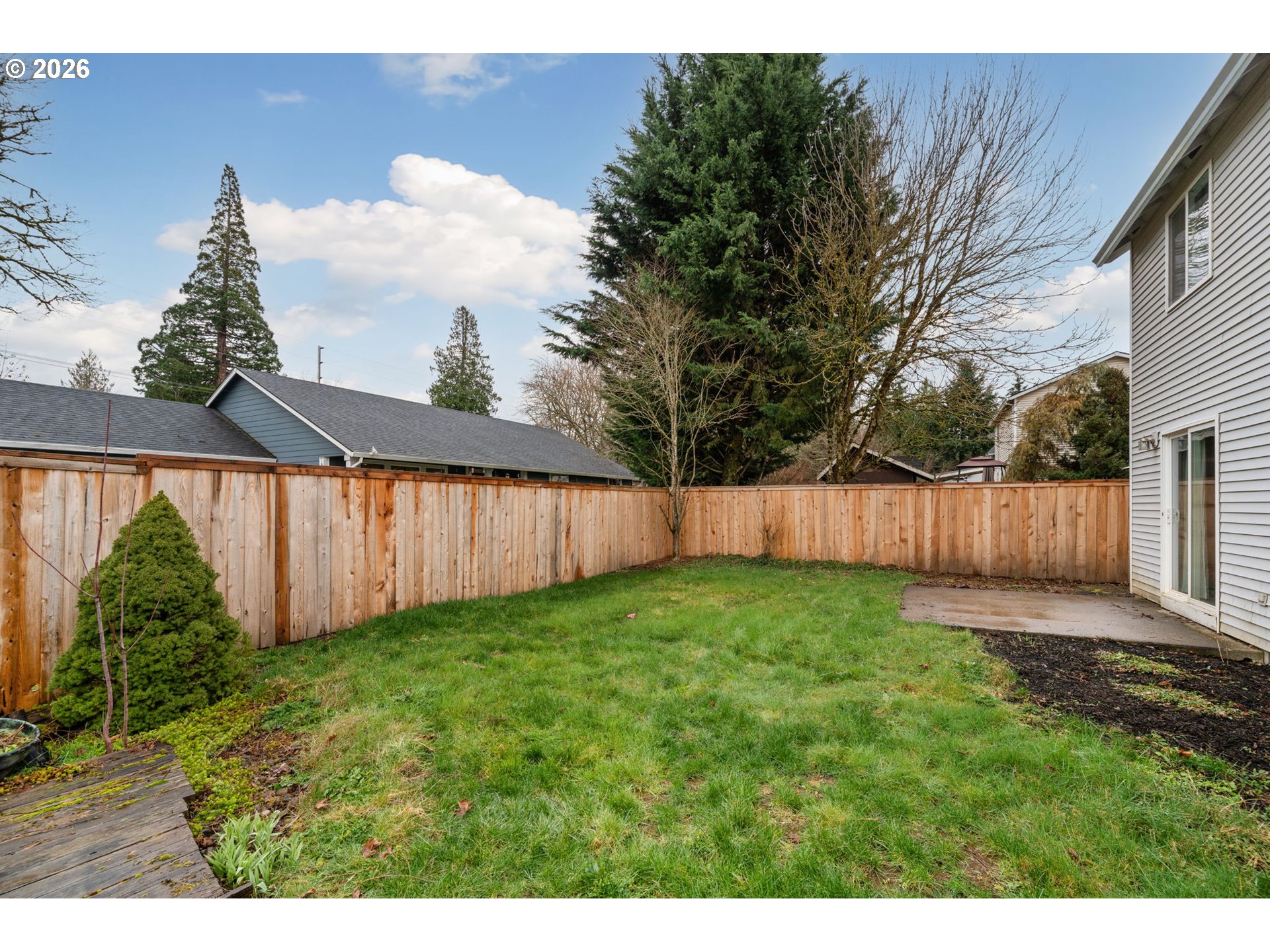 15902 Dreamcatcher Avenue Sandy, OR 97055 - Photo 31 of 32 a view of a backyard with wooden fence