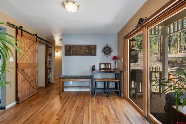 a bedroom with furniture and a flat screen tv