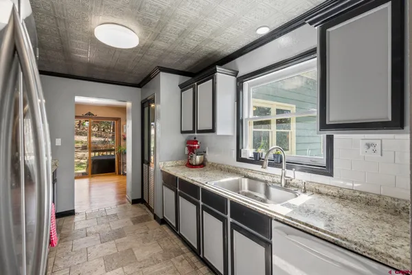 a bed room with a bed and a window