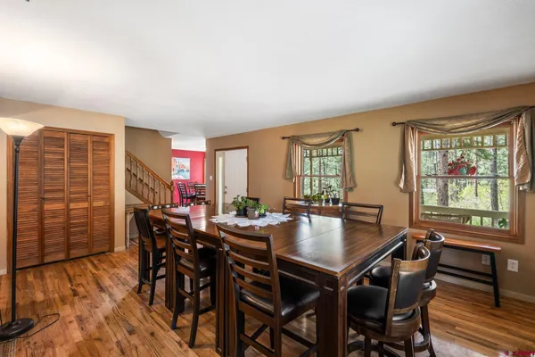a view of a house with a yard and tree s