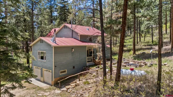 a view of a livingroom with furniture and hardwood floor