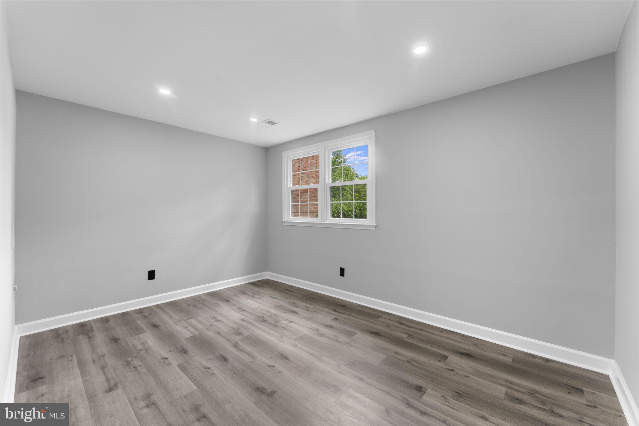1044 A Ramsgate Court Sterling, VA 20164 - Photo 11 of 20 a view of empty room with wooden floor and fan