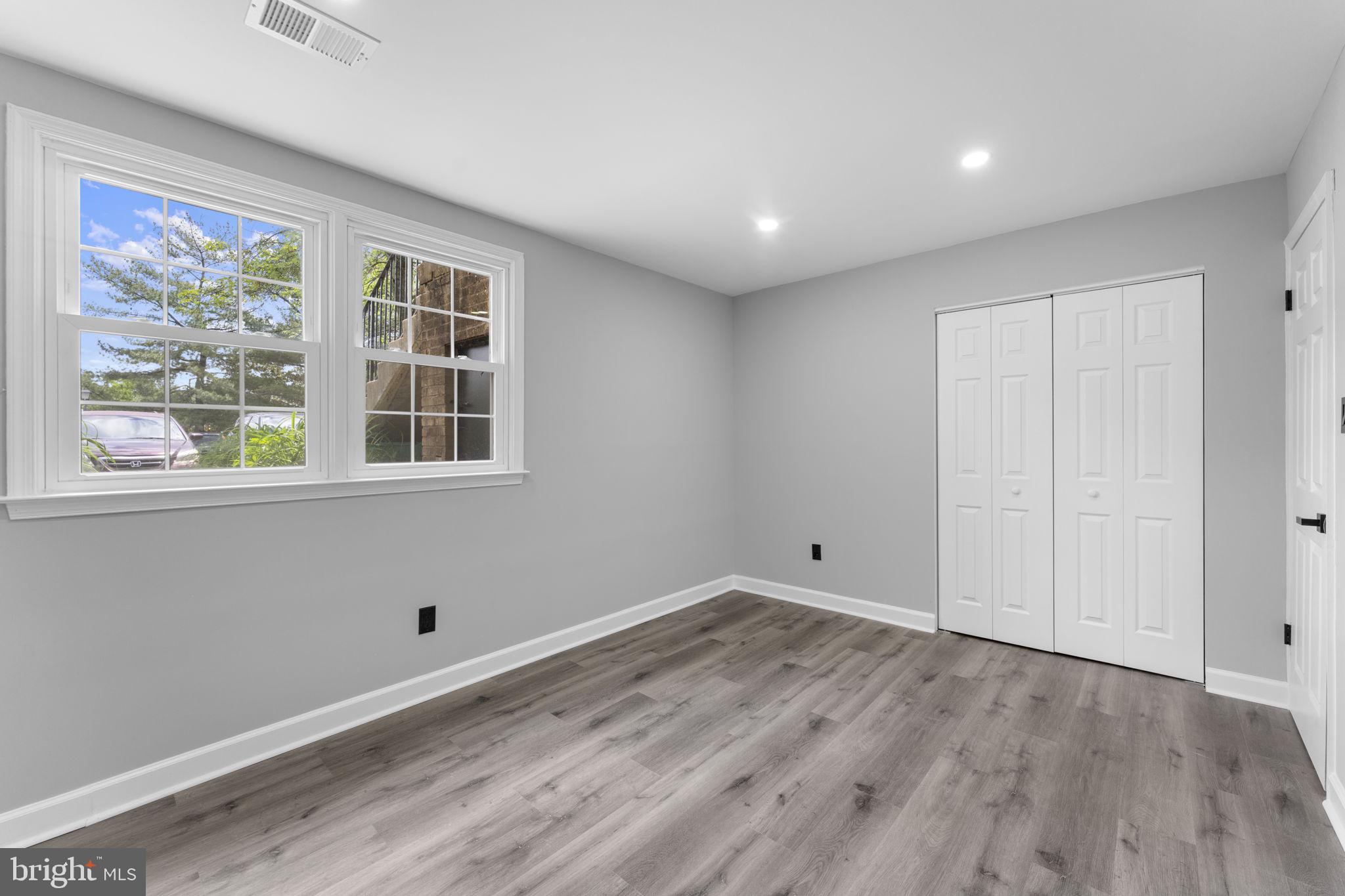 1044 A Ramsgate Court Sterling, VA 20164 - Photo 12 of 20 a view of empty room with wooden floor and fan