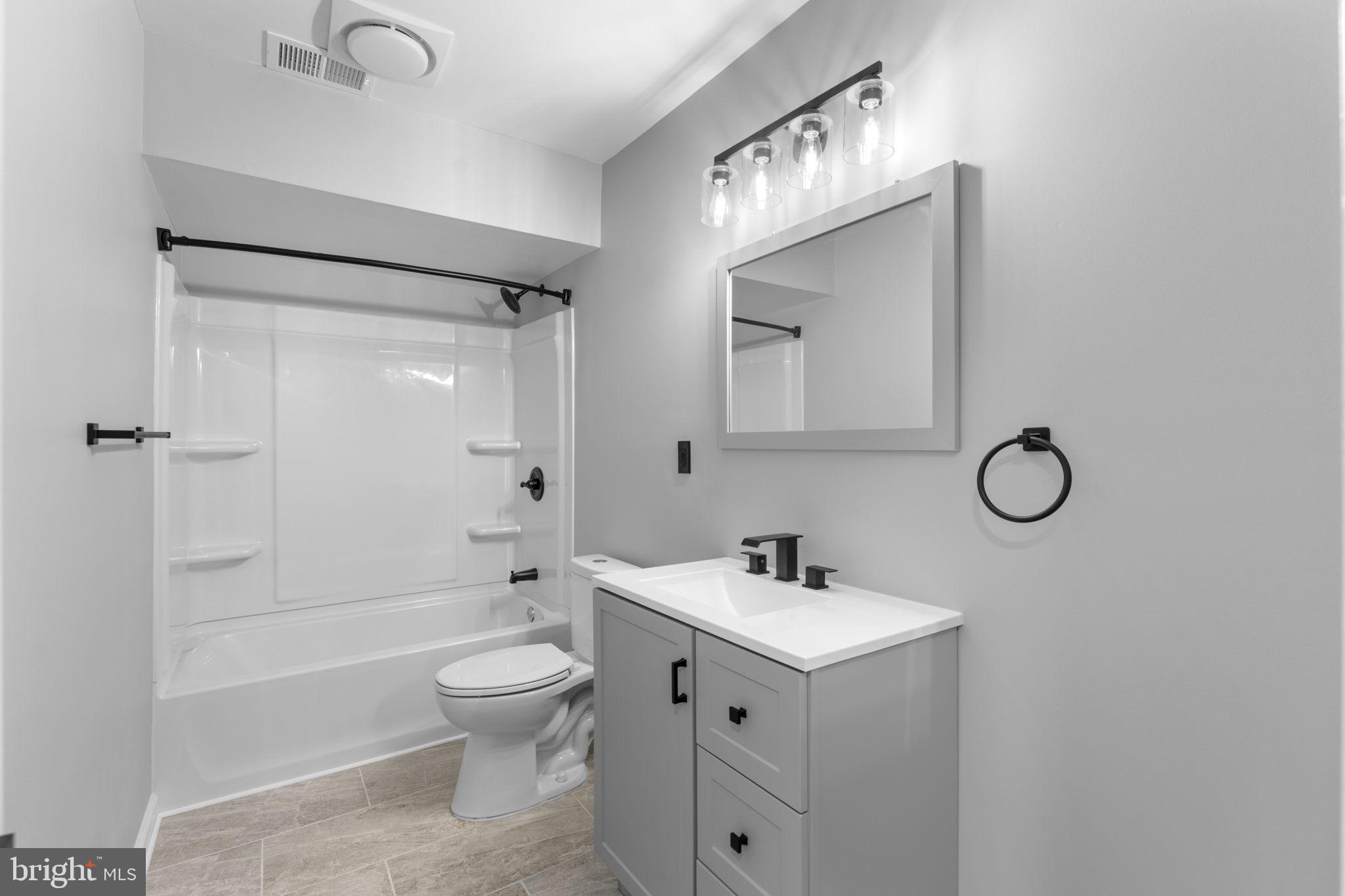 1044 A Ramsgate Court Sterling, VA 20164 - Photo 13 of 20 a bathroom with a toilet sink shower and mirror