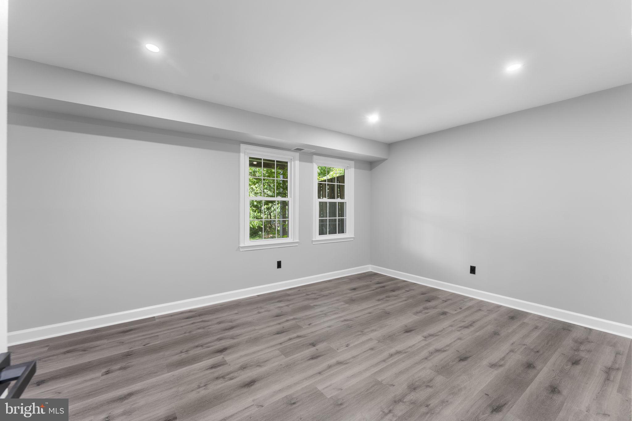 1044 A Ramsgate Court Sterling, VA 20164 - Photo 14 of 20 a view of room with window and wooden floor