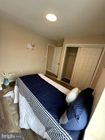 a view of an empty room and wooden floor