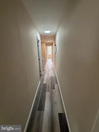 a view of gallery with wooden floor