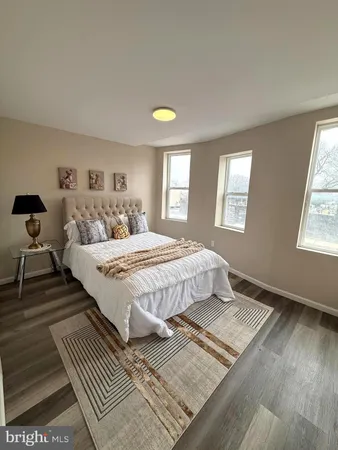 a bedroom with double bed and a window