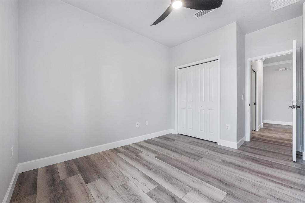 6703 Southwest 10th Lane Gainesville, FL 32607 - Photo 12 of 33 wooden floor in an empty room